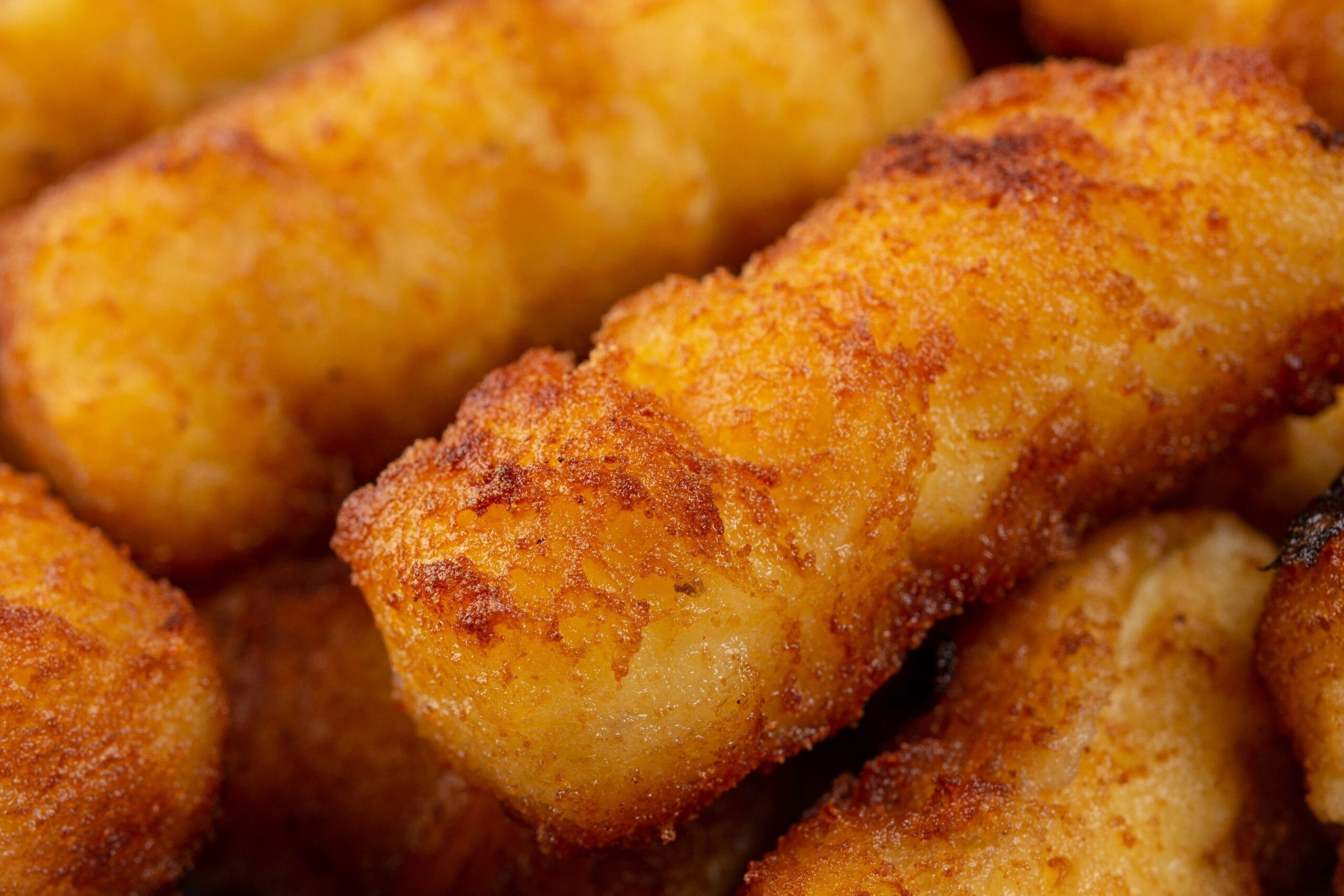 Crispy golden tequeños filled with cheese, a traditional Venezuelan appetizer