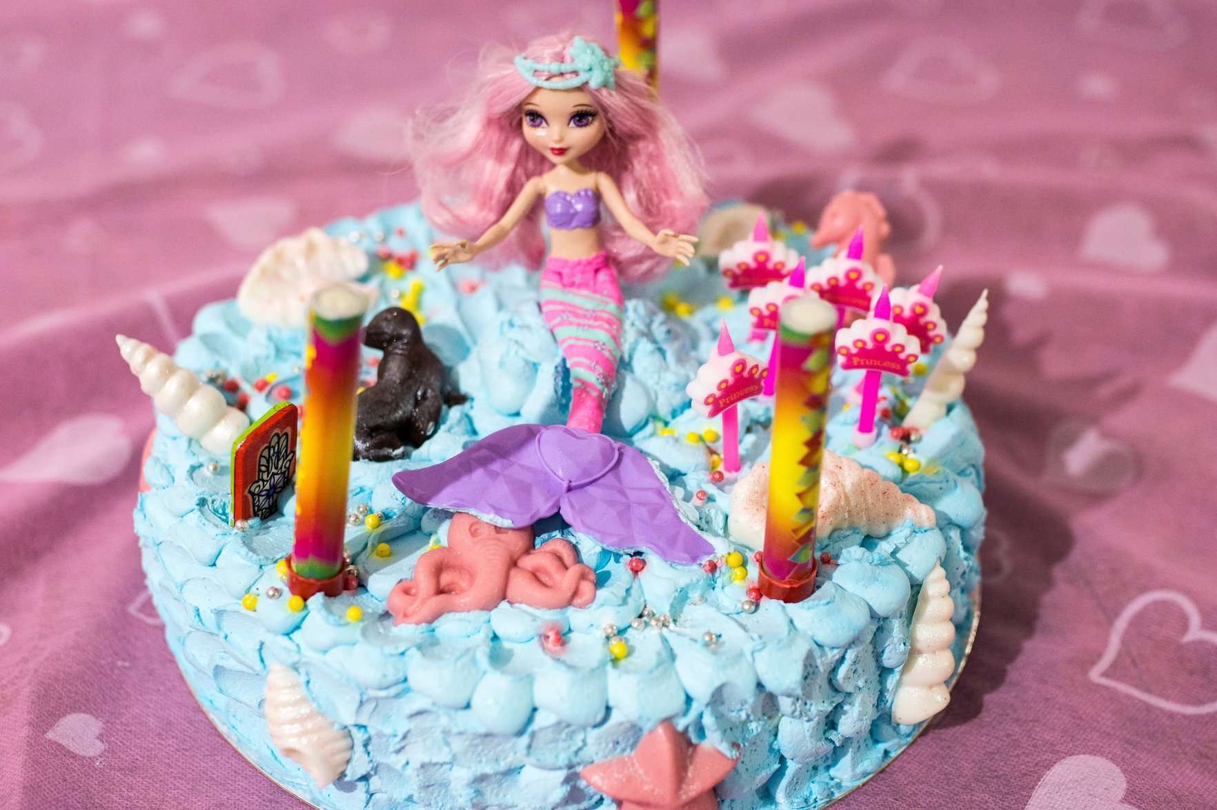 A beautifully designed Barbie-themed cake with intricate details and vibrant colors, perfect for birthdays and celebrations.