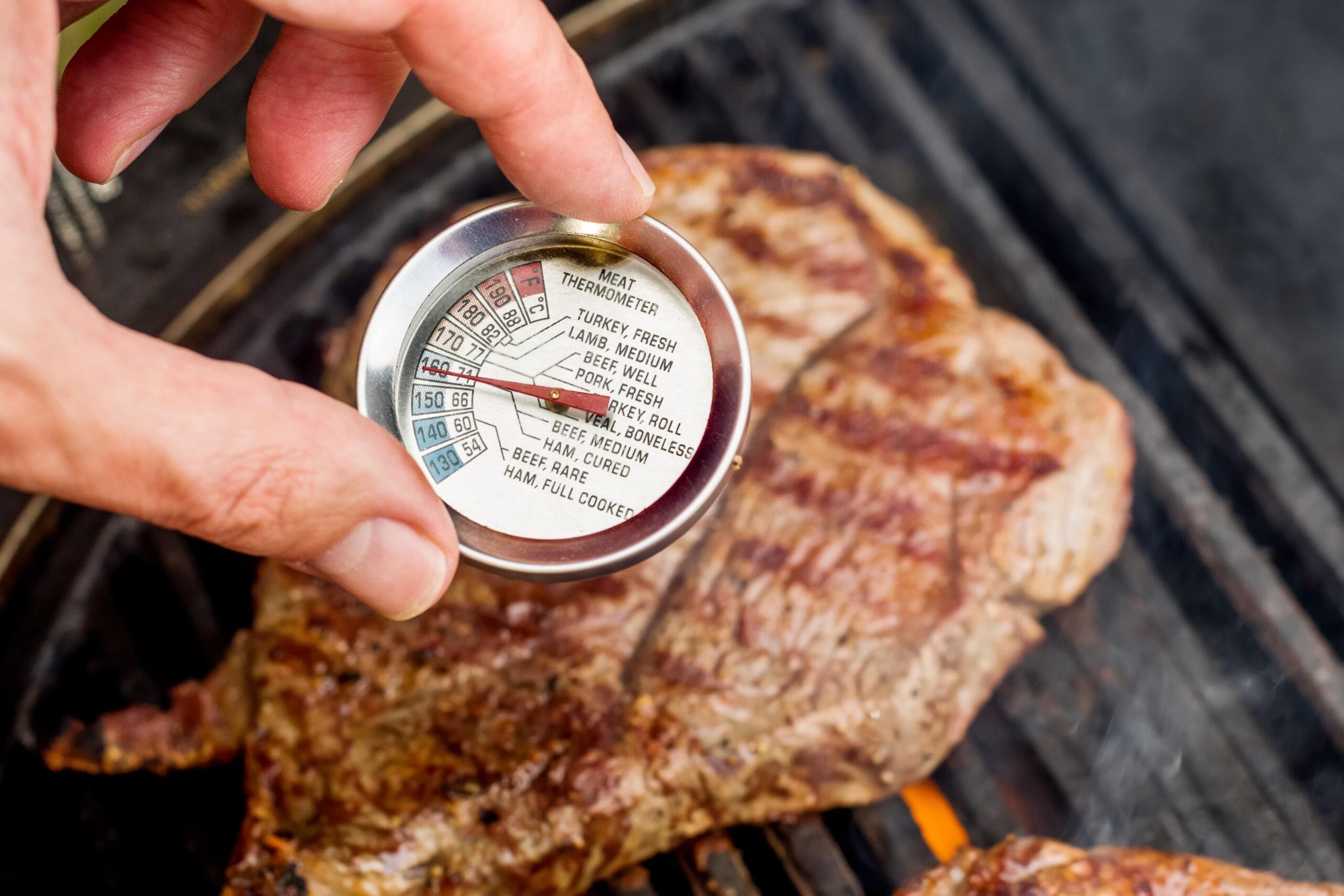 A juicy medium steak cooked to perfection, showing a warm pink center.