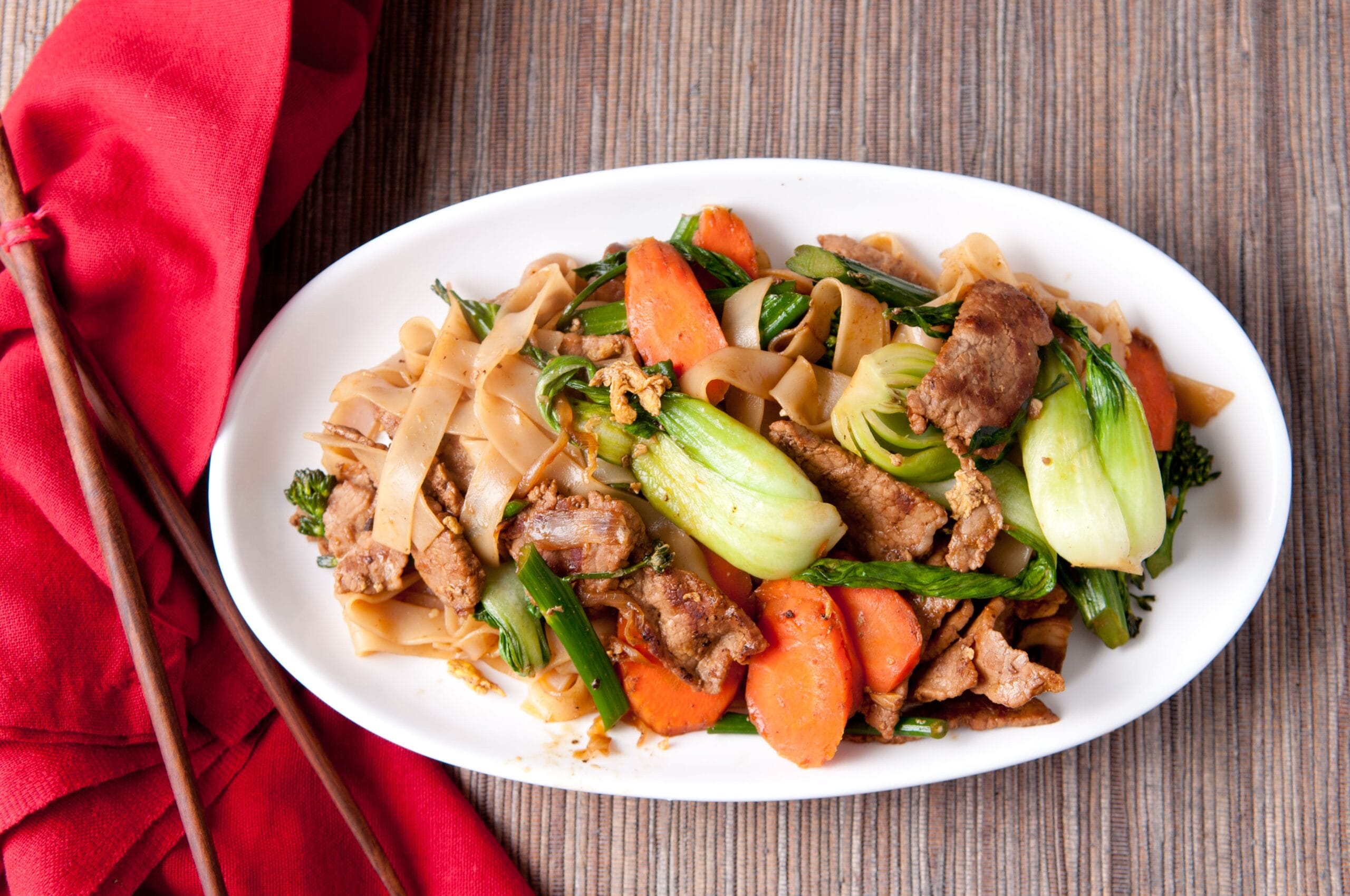 A vibrant bowl of chop suey, a classic stir-fry dish with vegetables, meat, and savory sauce.