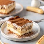 cottage cheese tiramisu served in glass dish with cocoa and mint